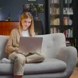 Person reading at home on the couch