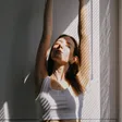 Person stretching in morning light