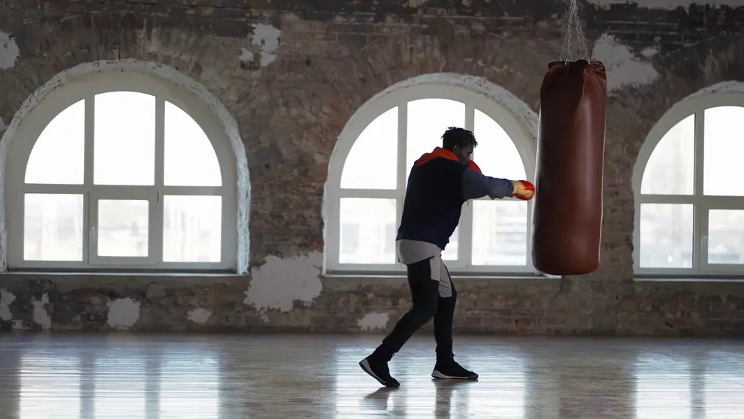 Person boxing with a punching bag